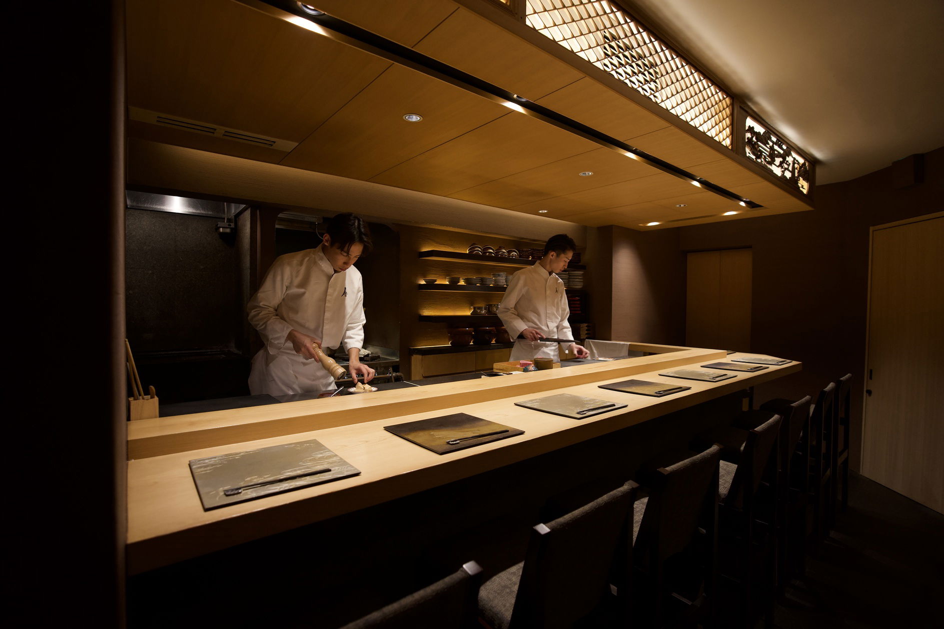 Chefs hard at work behind the counter of Yakiniku Kappo Note.